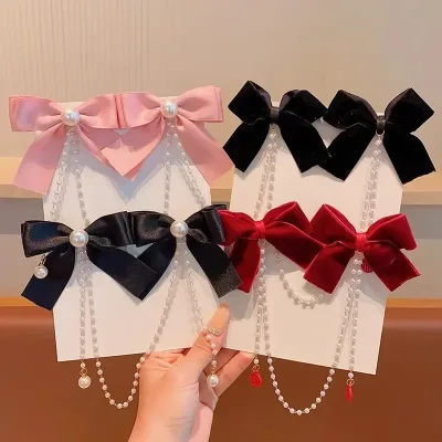 Pinces à cheveux velours nœud perlé enfant – image 3